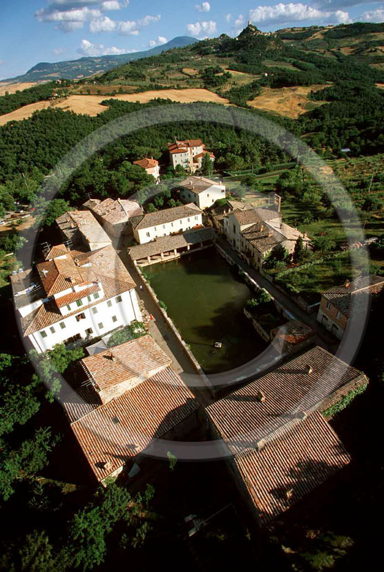 2000 - Aerial view of Bagno Vignoni village and the main square of thermal bath, Orcia valley, 27 miles south province of Siena. 