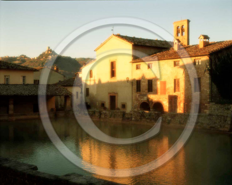 2001 - View of Bagno Vignoni village and the main square of thermal bath on sunrise, Orcia valley, 27 miles south province of Siena.