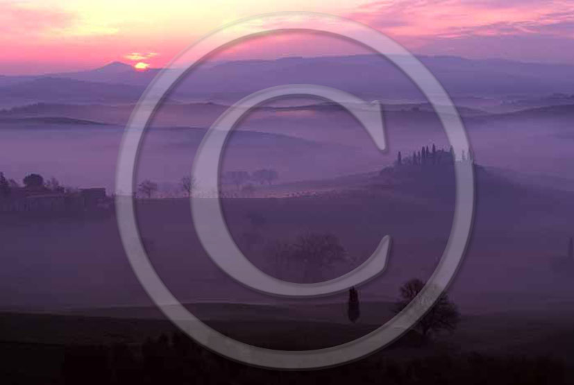 2005 - Landscapes of farm and cipress with fog on sunrise in winter near S.Quirico village, Orcia valley 21 miles south province of Siena.