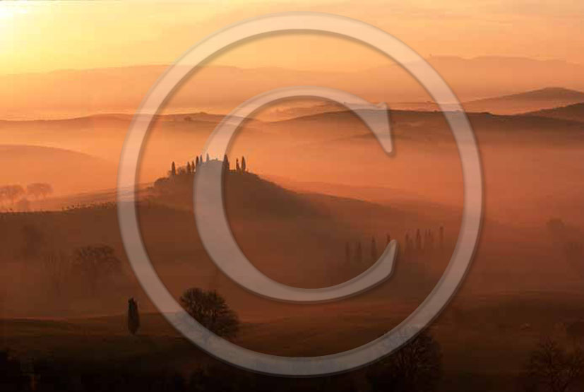 2005 - Landscapes of farm and cipress with fog on sunrise in winter near S.Quirico village, Orcia valley, 21 miles south province of Siena.