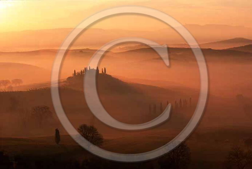 2005 - Landscapes of farm and cipress with fog on sunrise in winter near S.Quirico village, Orcia valley, 21 miles south province of Siena.