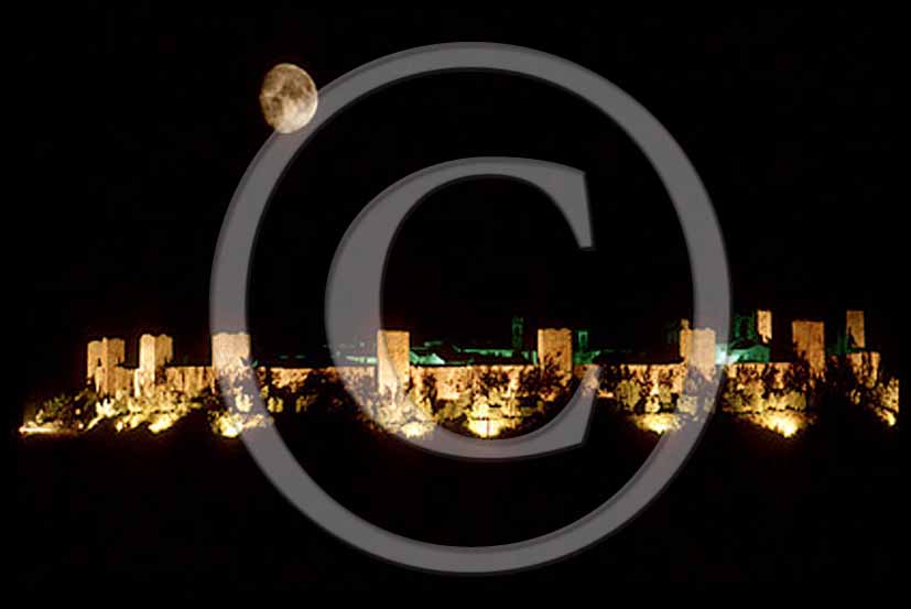 1992 - Night view with the moon of the towers of Monteriggioni medieval village.