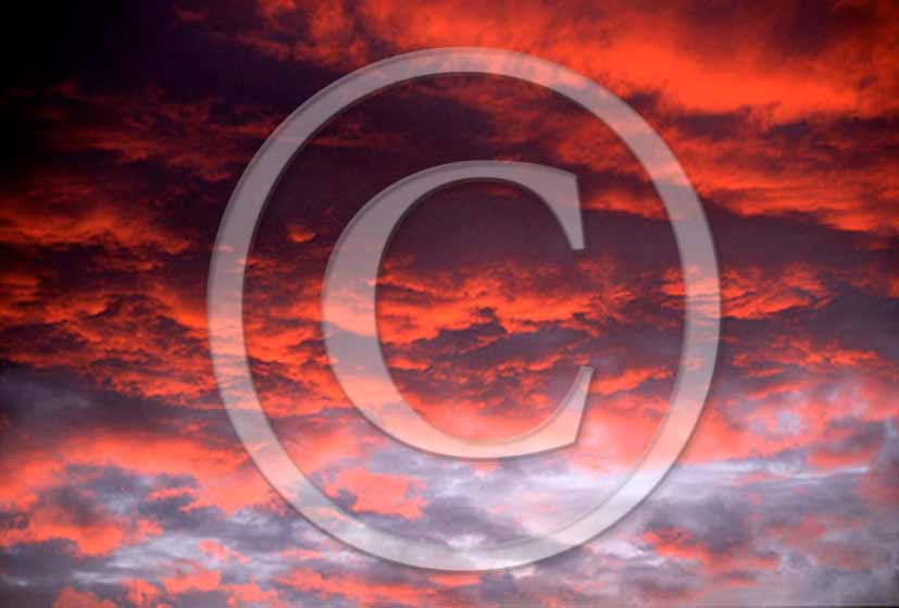1998 - Red clouds in bleu sky on sunset.