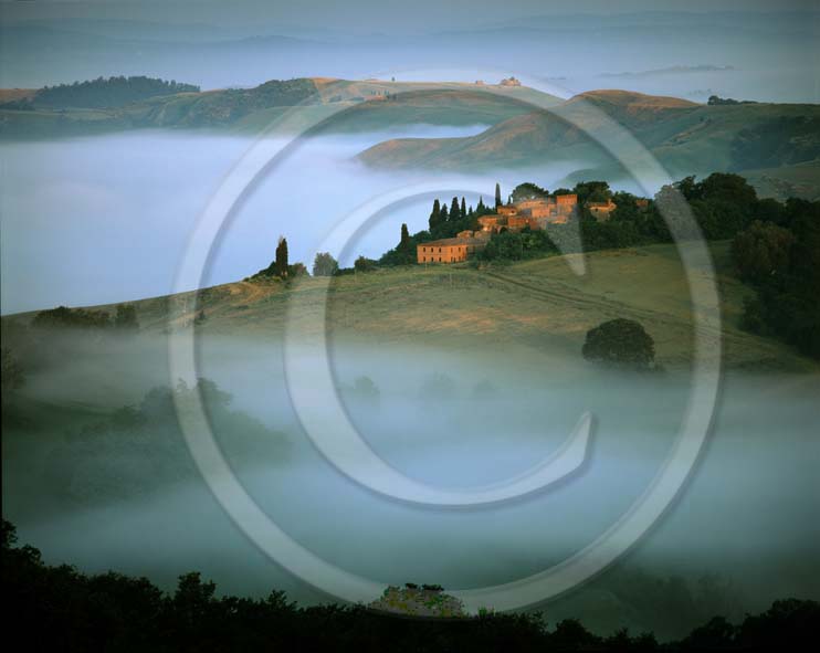 2002 - Landscapes of farm with fog on sunrise in winter, Montemori place, near Asciano village, Crete Senesi land, 18 miles south province of Siena.