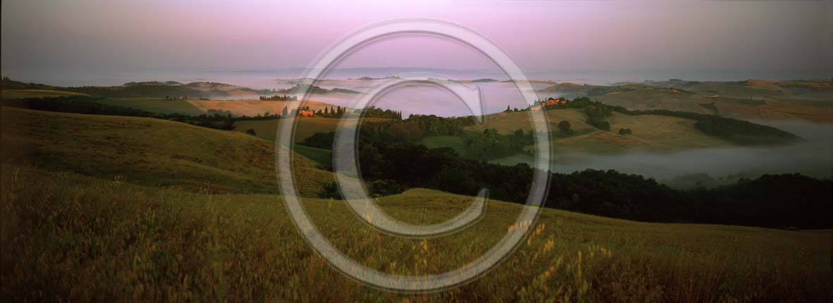 2002 - Panoramic view of sunrise with fog near Montemori place, Crete Senesi land, near Asciano village, 17 miles south province of Siena.