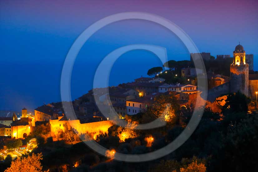 2012 - night view of Castiglione della Pescaia medieval village on Tirreno sea in Maremma land.