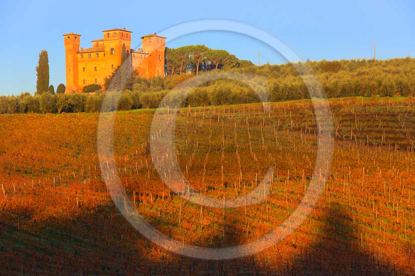 2012 - View on sunrise in autumn at Castle of Four Towers and its vineyards near Siena in crete Senesi land.