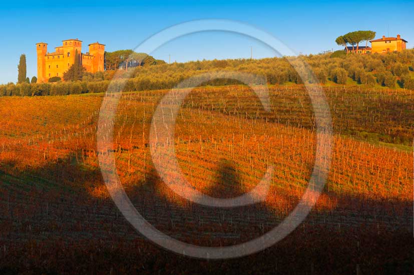 2012 - View on sunrise in autumn at Castle of Four Towers and its vineyards near Siena in crete Senesi land.
