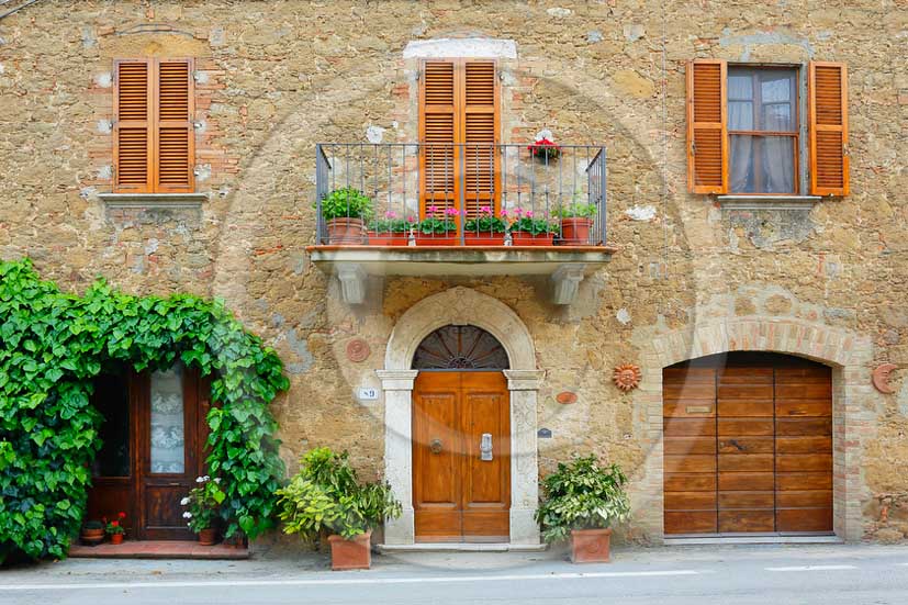 2013 - Traditional tuscan doors with red and yellow Gerani flowers.