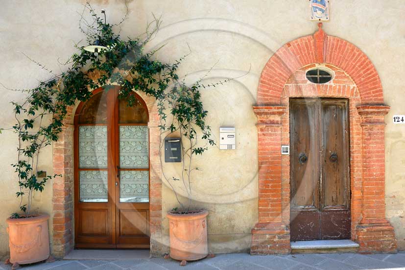 2013 - Traditional tuscan doors with red and yellow Gerani flowers.