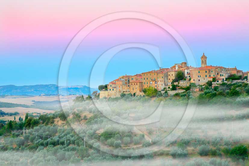 2013 - View before a sunrise with fog of Castelmuzio village in Orcia valley.