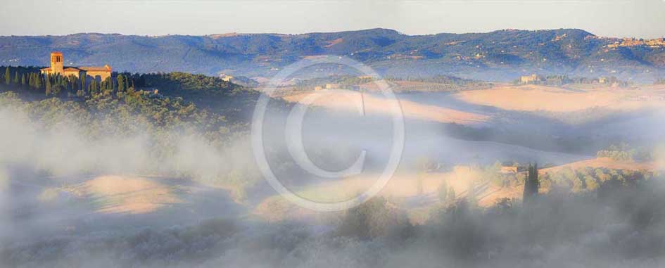 2013 - Panoramic view at sunrise with fog of Orcia valley with Saint Anna in Camprena Monasty near Castelmuzio village.