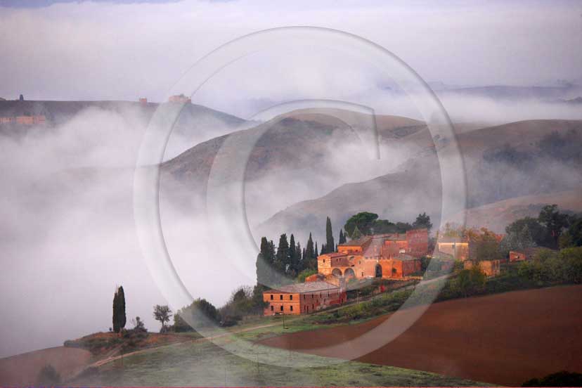   			  			2008 - Panoramic view of landscapes and farm with fog on sunrise in winter, Montemori place, near Asciano village, Crete Senesi land, 18 miles south province of Siena.  			
  			
  			
  			