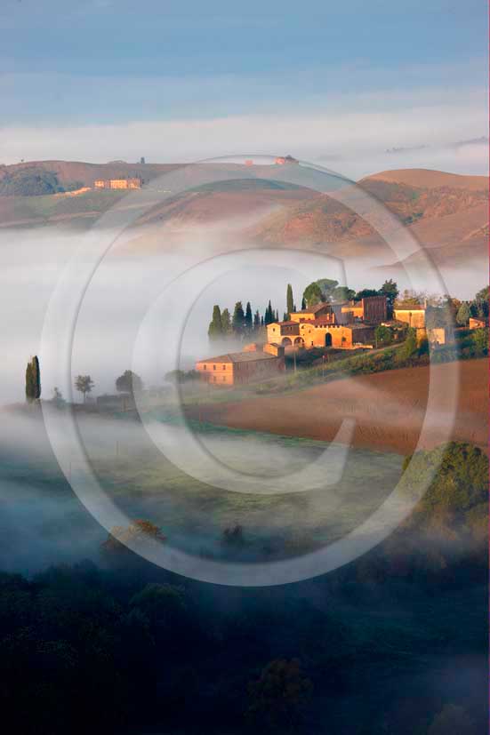 2008 - Landscapes of farm and cipress with fog on early morning at
sunrise in winter, Montemori place, near Asciano village, Crete senesi
land, 18 miles south the province of Siena.  			
  			