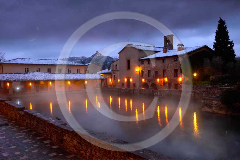 2009 - Night view of Bagno Vignoni village and the main square of thermal
bath with snow in winter before sunset, Orcia valley, 27 miles south province of
Siena.  			
  			