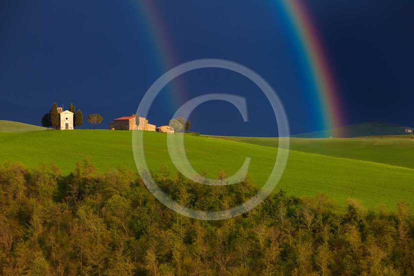 2009 - Landscapes of farm and country church with rainbow a bit after a
thunderstorm in spring, near Pienza village, 22 miles south province of
Siena.  			
  			