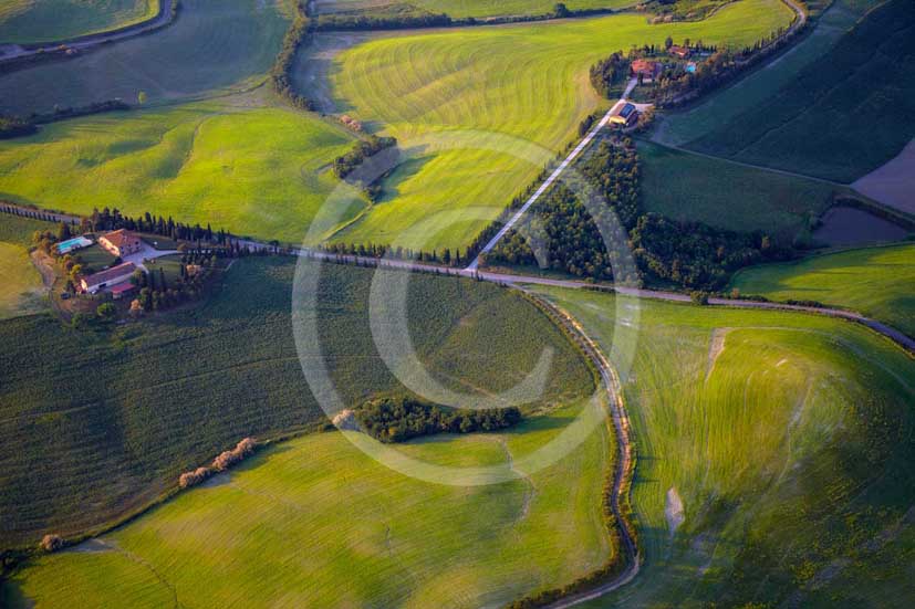 2009 - Aerial view of landscapes with farm and cypress line on late afternoon in springs, near Volterra medieval village, Era valley, 26 miles south east Pisa province.  			
  			