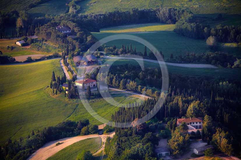 2009 - Aerial view of landscapes with farm and cypress line on late
afternoon in springs, near Volterra medieval village, Era valley, 26
miles south east Pisa province.  			
  			