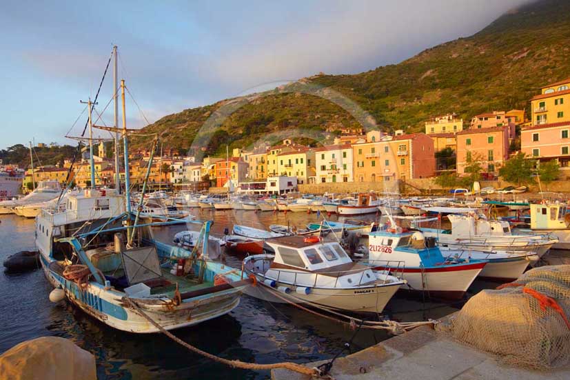 2009 - View of the port and old fisher's boats of Isle of Giglio in early morning on summer, Maremma land, 80 miles south the province of Grosseto.