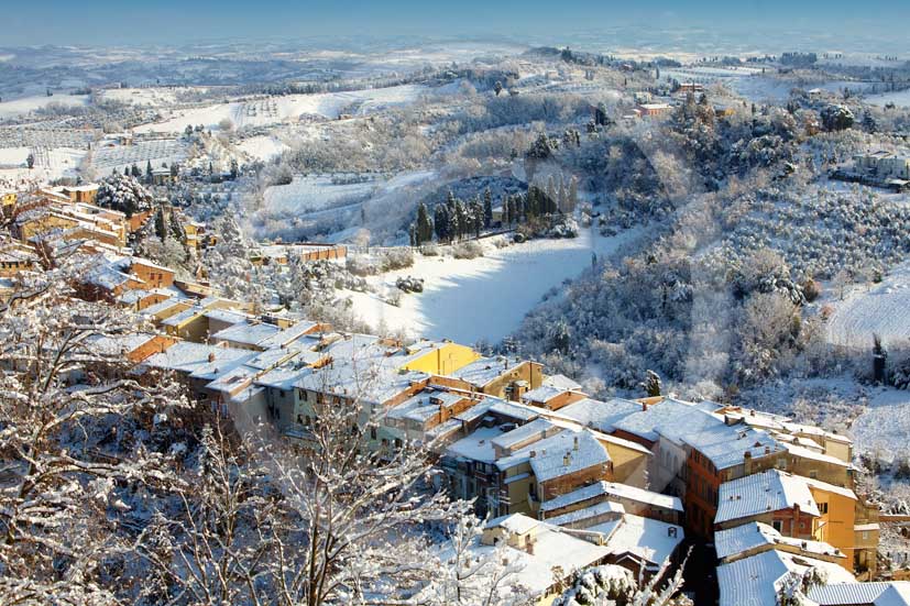 2009 - Surrounding country viewer with the typical tuscan house top under the snow in winter on early morning, near San Miniato village, Era valley, 22 miles east Pisa province.