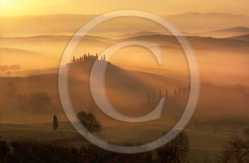 2011 - View in autumn on sunrise with fog of farm and cypress skyline in Orcia valley near San Qurico Orcia.