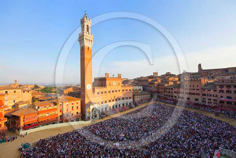 2011 - Aerial view of the main square Il Campo of Siena town with the palace of the Council and the tower during the horse race of the Palio.