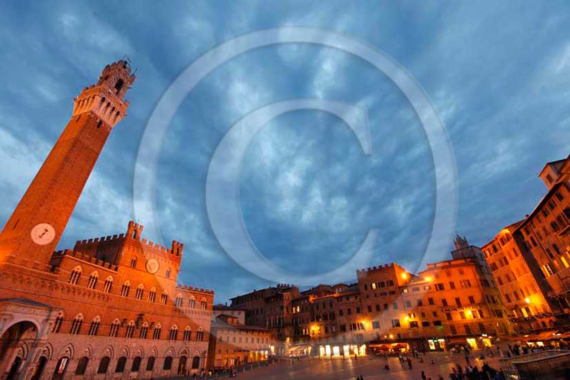 2011 - View of the main square Il Campo of Siena town on late afternoon with the palace of the Council and the tower.